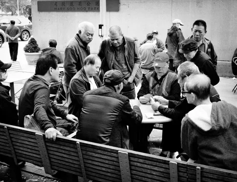Group of men playing cards in Chinatown Boston
